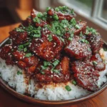 Sticky Sweet Bourbon Chicken is a mouthwatering dish that perfectly blends the rich, smoky notes of bourbon with tender, juicy chicken thighs. This recipe stands out not only for its distinctive flavor profile but also for its ease of preparation, making it an ideal choice for both busy weeknight dinners and special occasions alike. The dish's signature sticky sauce, which is both sweet and savory, envelops the chicken, creating a comforting meal that is sure to impress family and friends.